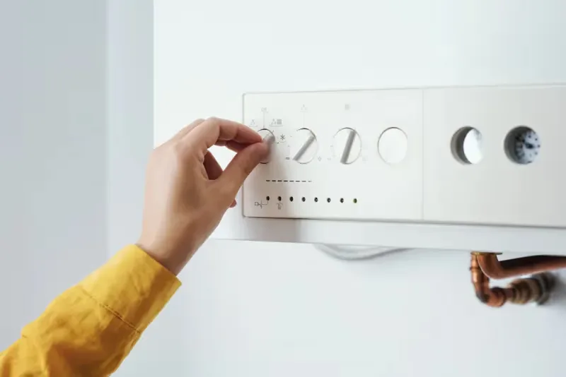 Adjusting the controls on a domestic gas boiler